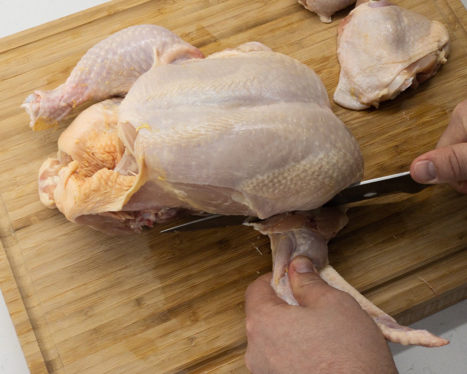 Removing a wing from a chicken