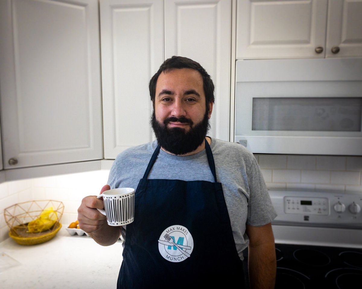 Max drinking coffee in the kitchen