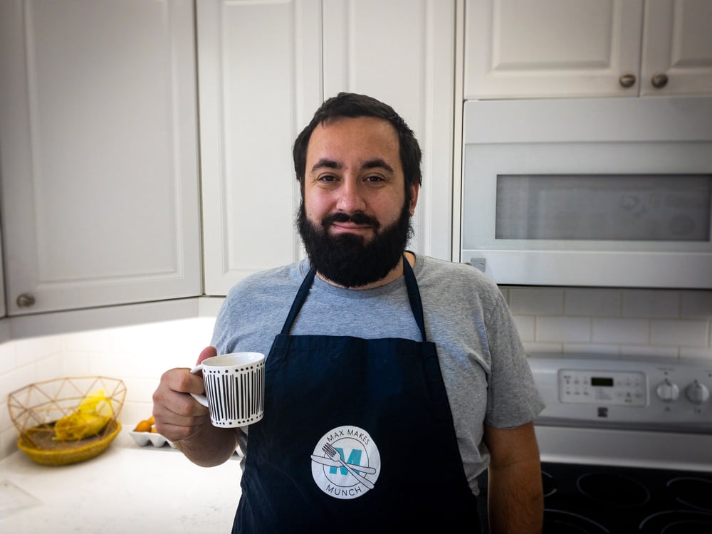 Max drinking coffee in the kitchen